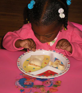 Little girl eating a meal